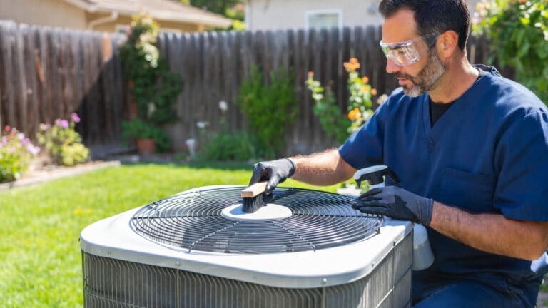 Pasadena heat pump maintenance technician cleaning outdoor coils for efficiency