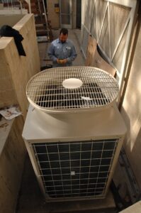 Air-Tro technician performing commercial HVAC repair on commercial HVAC unit in Pasadena