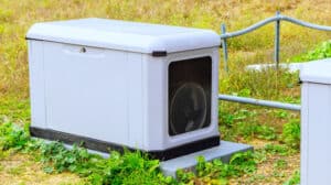 A reliable standby generator installed outside a Southern California home, providing backup power during a utility shut-off to keep lights and appliances running smoothly.