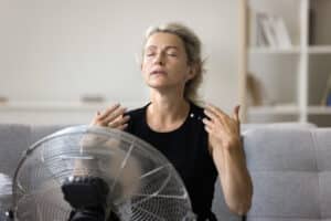hot homeowner before Air-Tro technician performing professional AC repair on a residential system in Pasadena, California, 2026